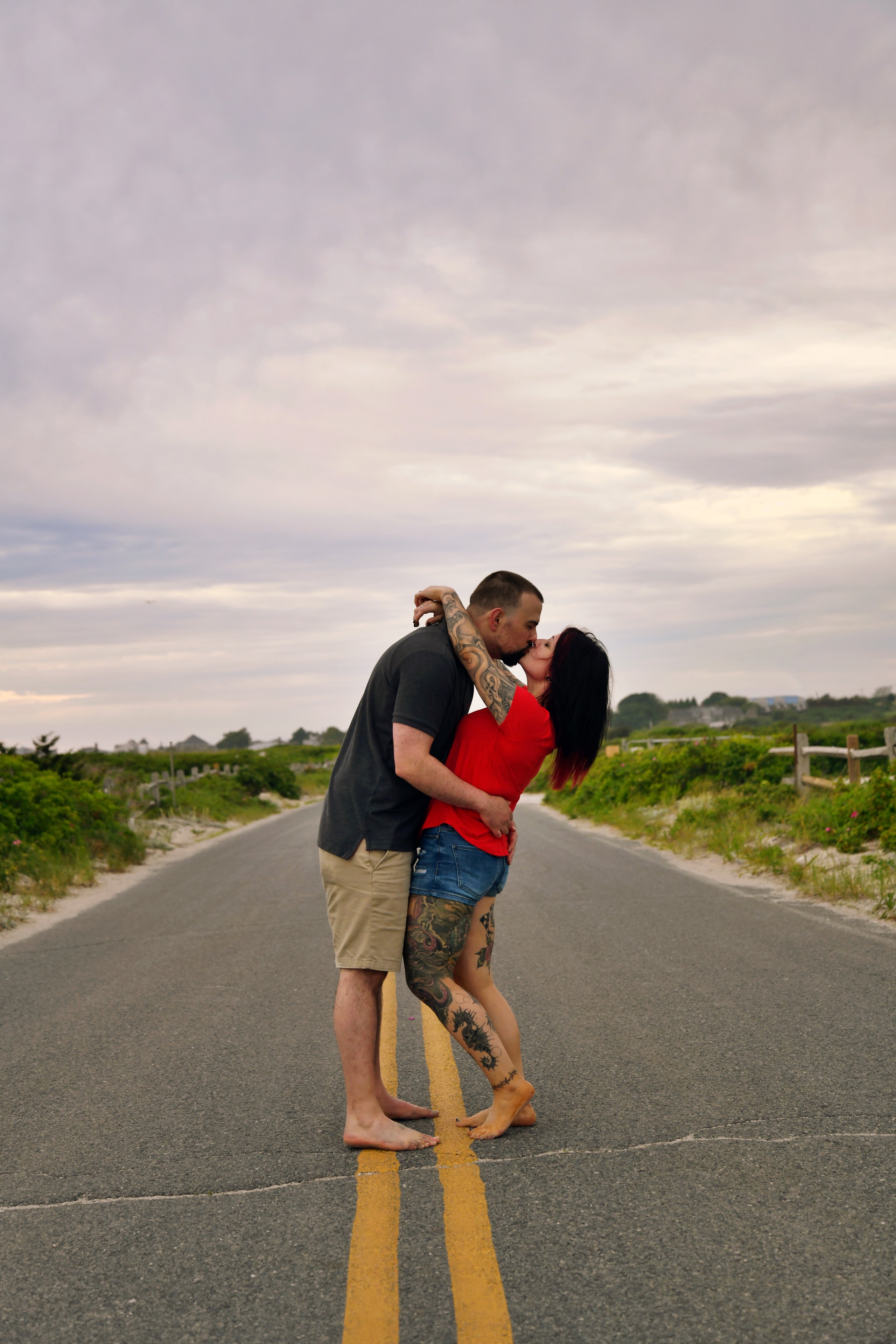 Couple kissing on a rural road