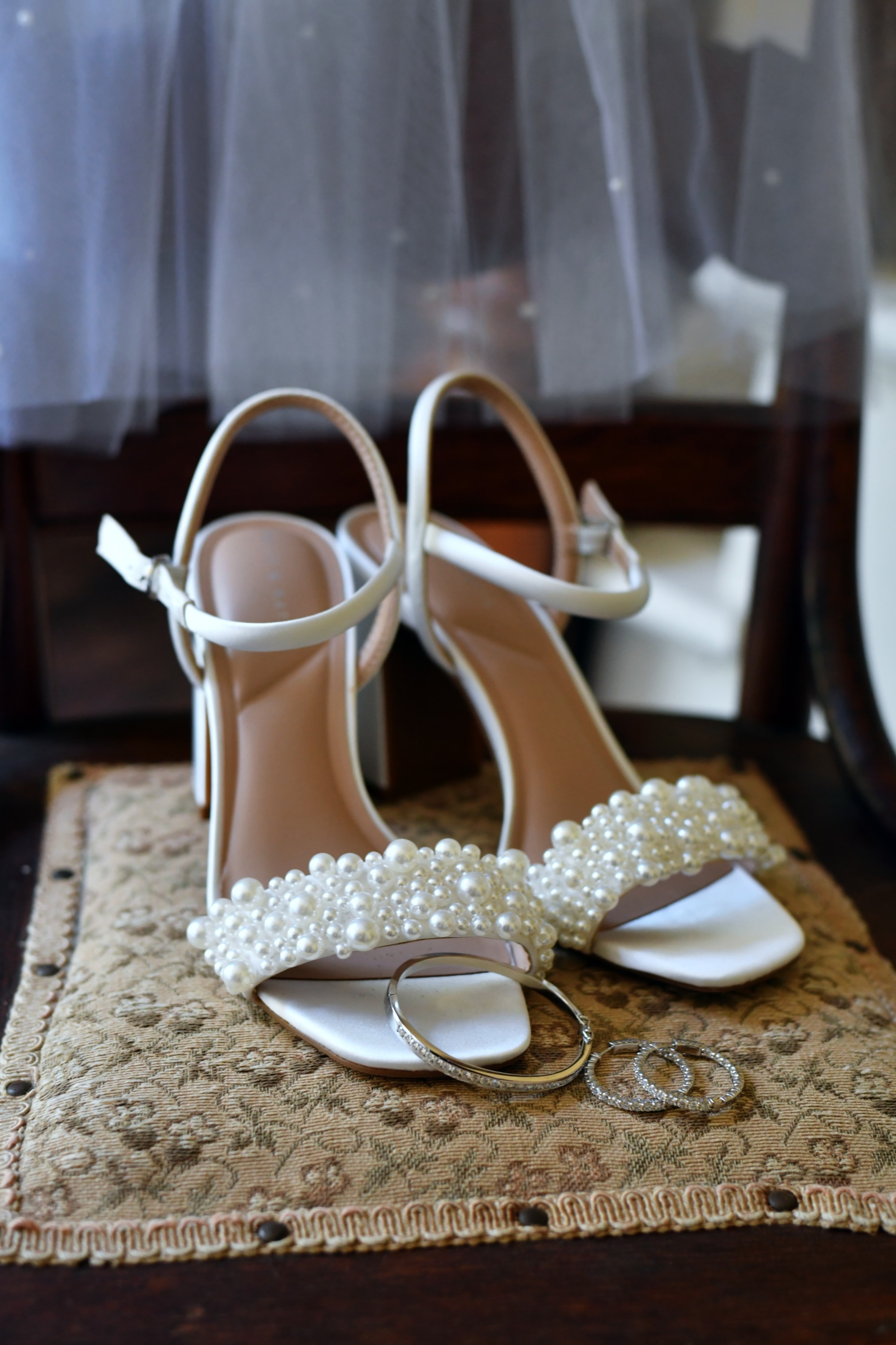 Pearl-embellished bridal heels with wedding rings