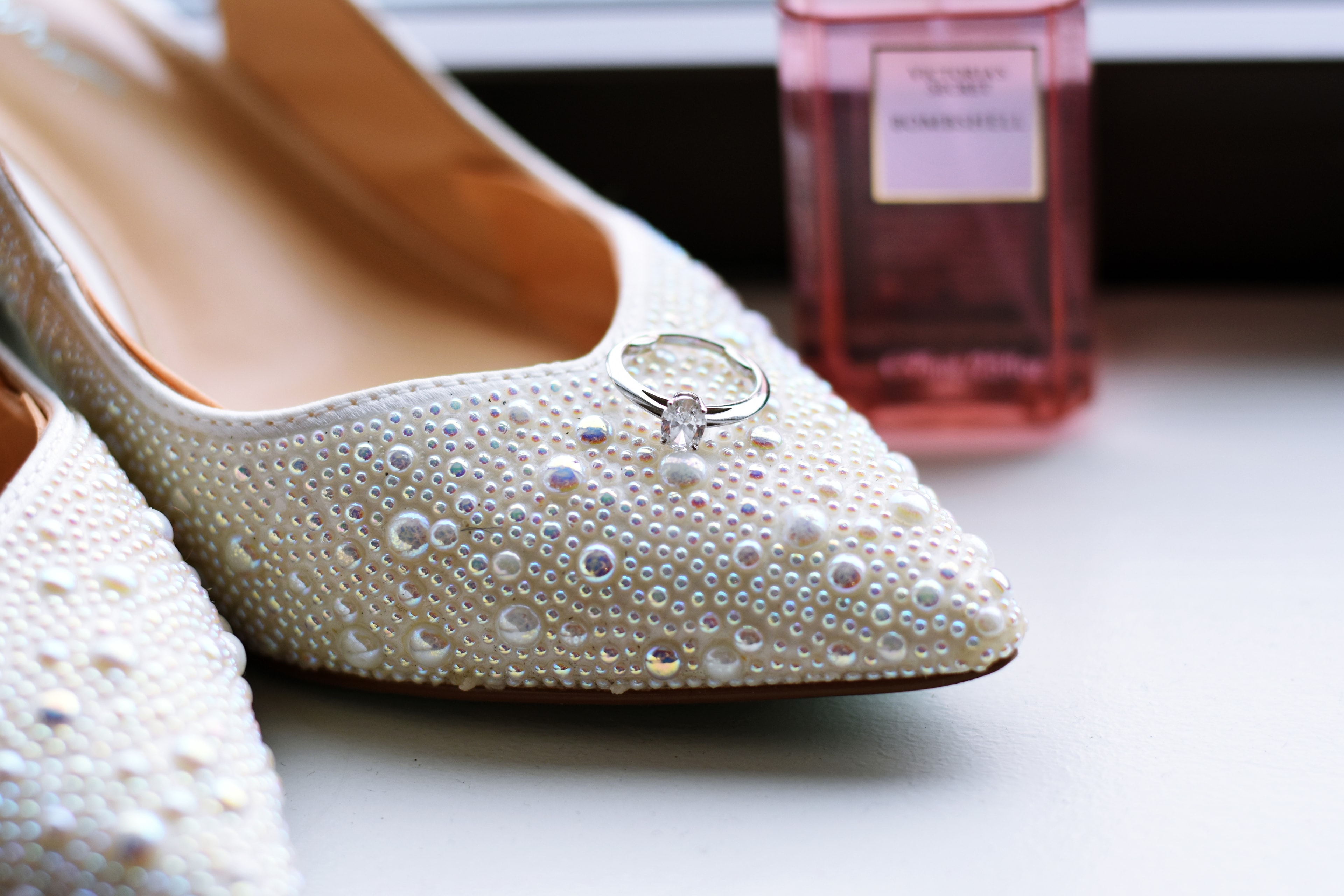 Pearl bridal flats with diamond engagement ring