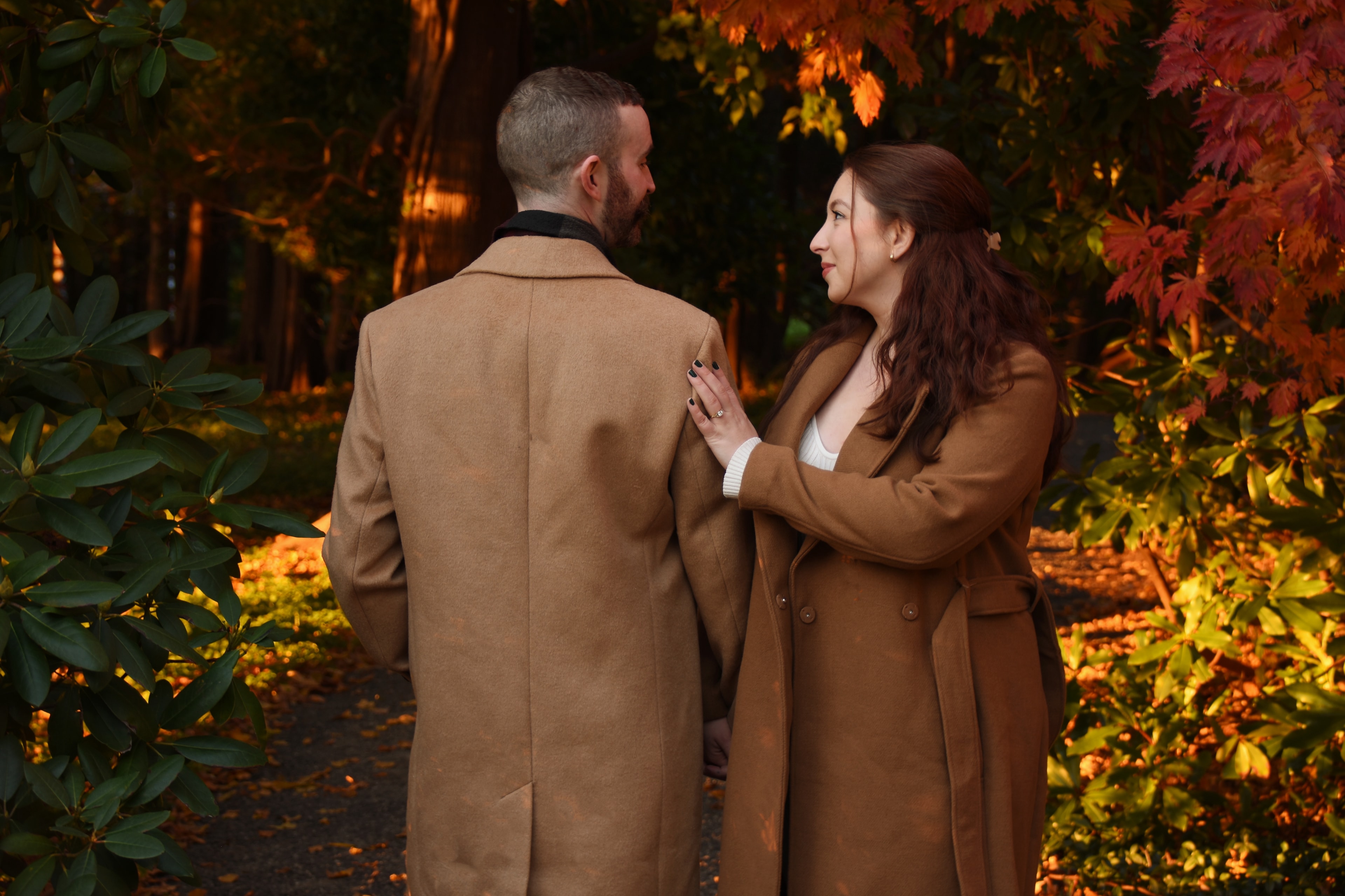 Couple walking autumn garden path