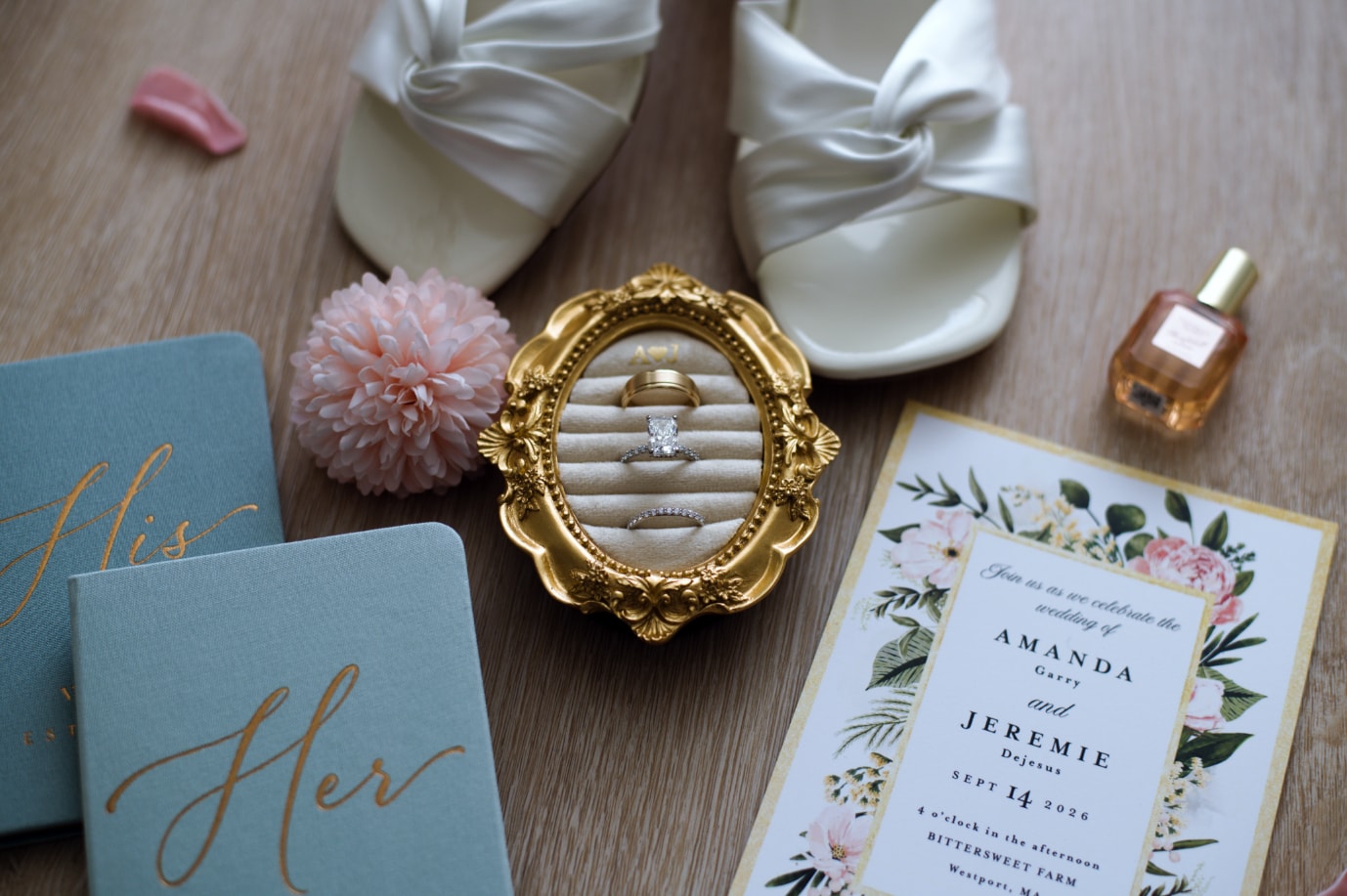 Wedding flat-lay with rings in gold frame, shoes, invitation and vow books