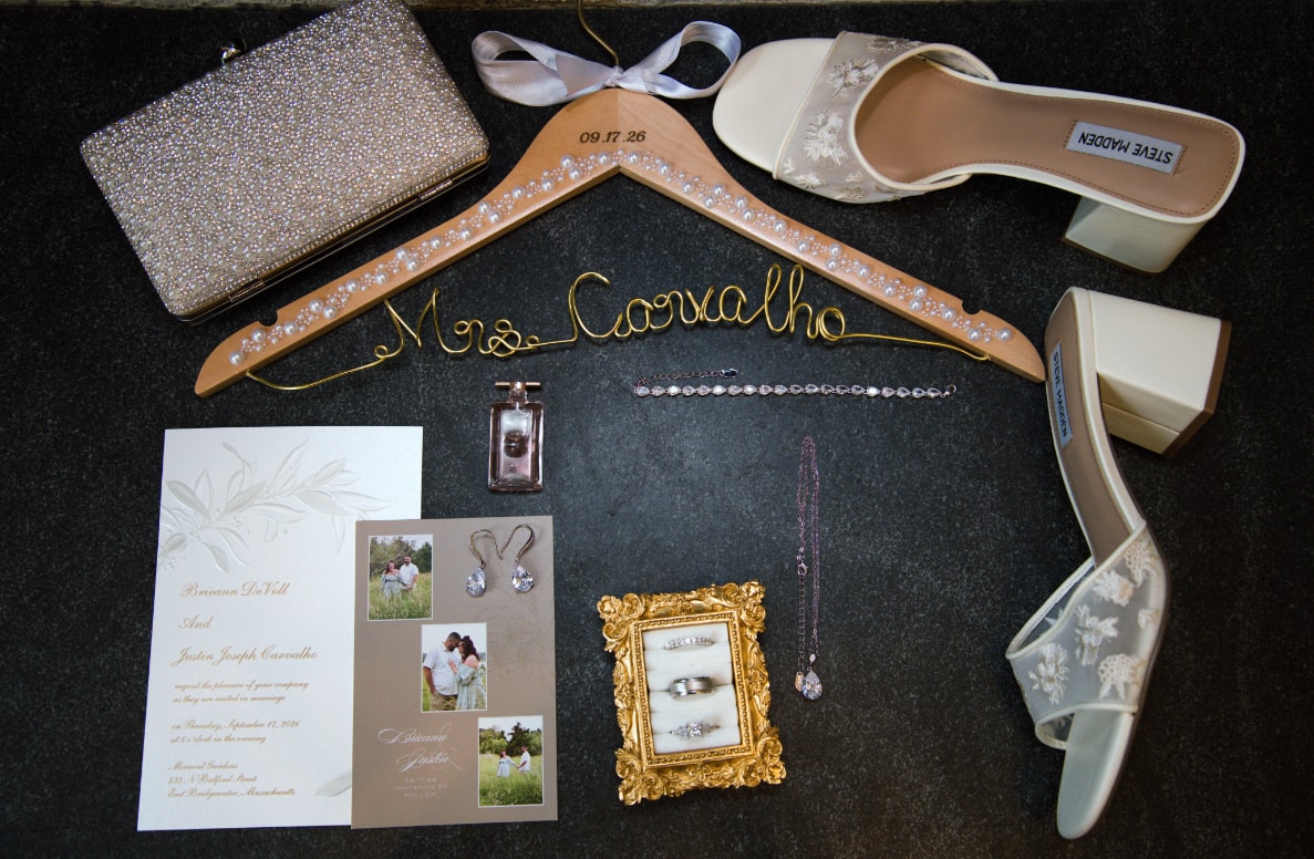 Wedding flat-lay with Mrs. Carvalho hanger, shoes, rings, invitation and jewelry